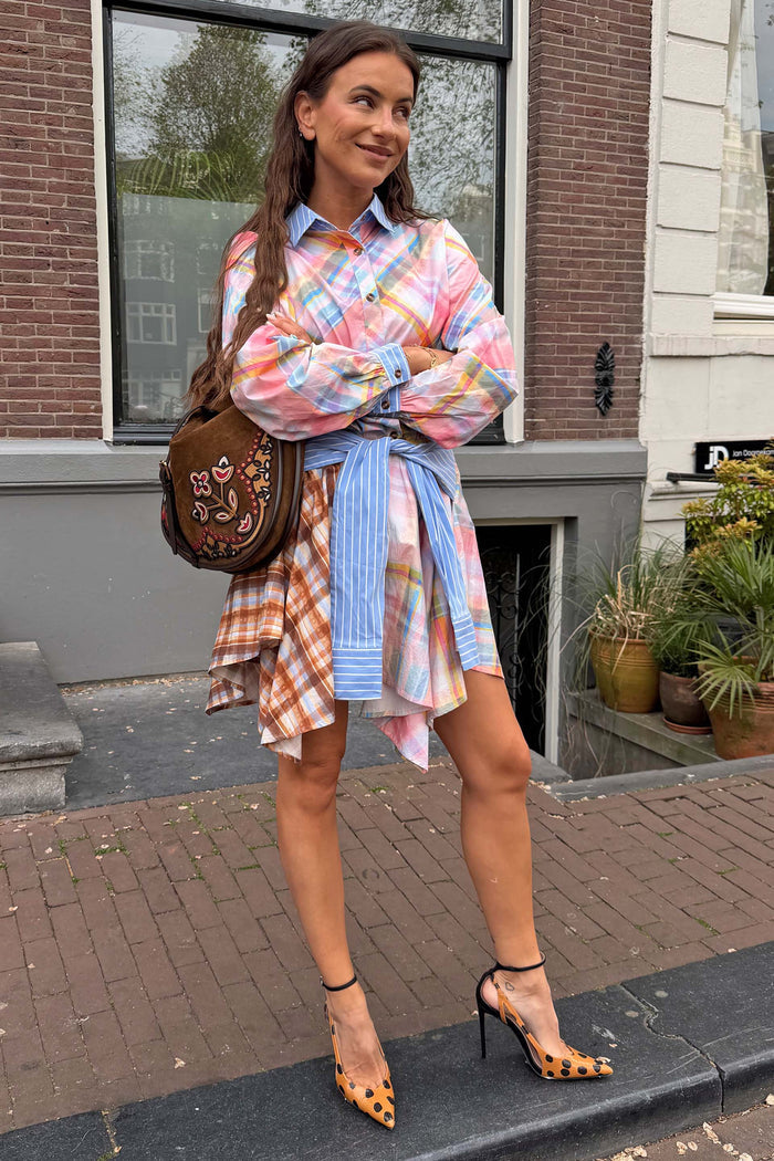 Pastel Check Shirt featuring a blue stripe pussy bow tied at the waist, paired with a matching skirt for a London look.