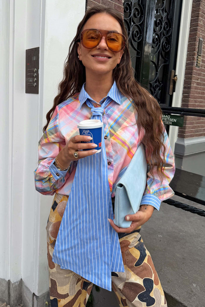 Pastel check cotton shirt with a blue striped detachable pussy bow, styled as a necktie for a London look.