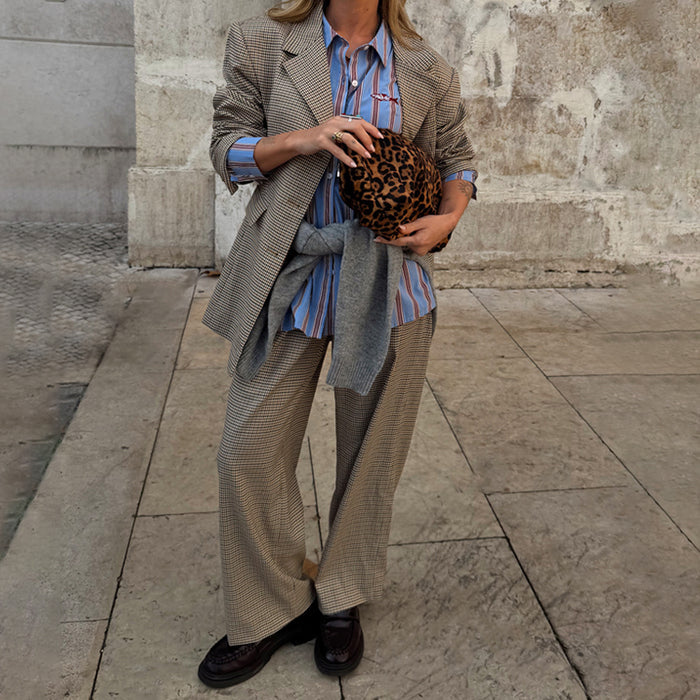 Grey Check Trousers in a smart-casual print styled with a matching blazer, striped shirt, and leopard clutch.