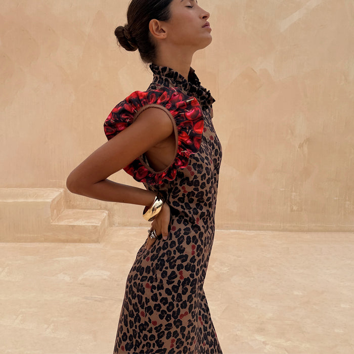 Cherry Leopard Remi Dress with leopard print, red cherry pleated frill sleeves and a high ruffled neck.