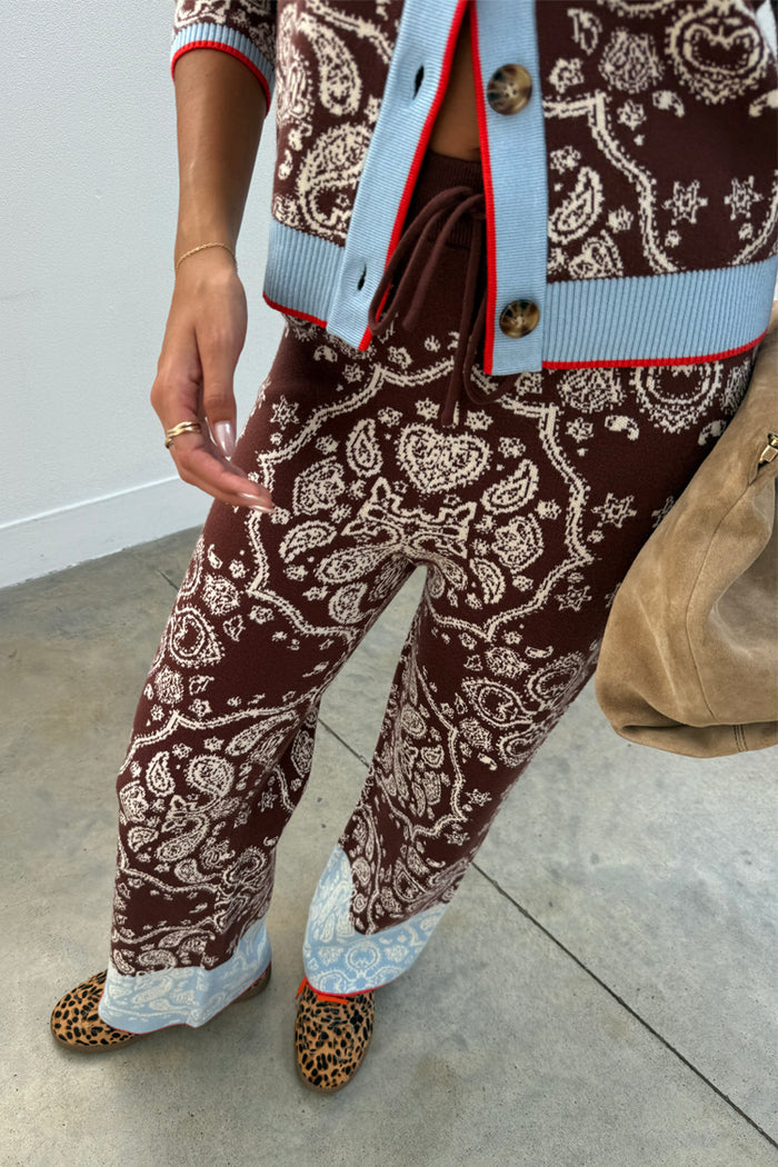 Chocolate brown bandana wide leg knit trousers featuring a blue contrast hem and drawstring waistband.