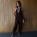 Chocolate Naomi Cargo Trousers in satin with a balloon leg, styled with a matching blue lace-trimmed top.