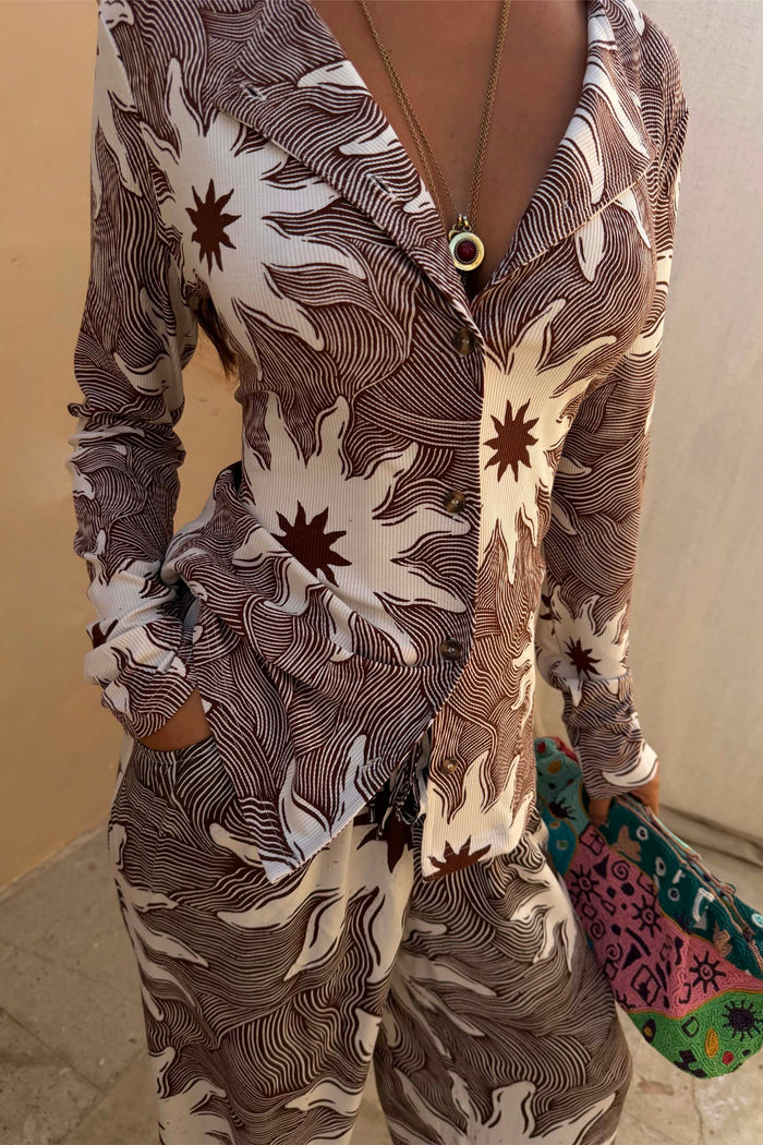 Chocolate Soleil Alexa Cardigan featuring a brown sun motif on ribbed fabric with button up front fastening.