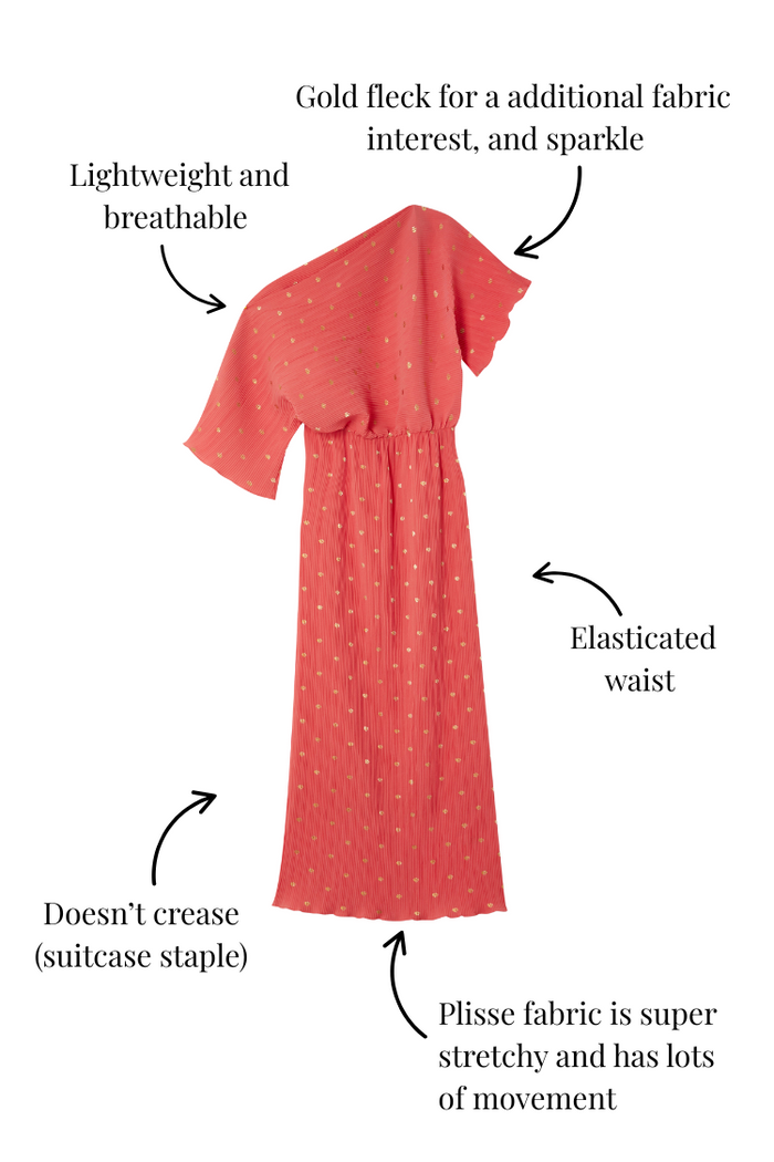 Coral Plisse Tilly Dress with gold flecks, an elasticated waist and crease-free plisse fabric, a vacation staple.