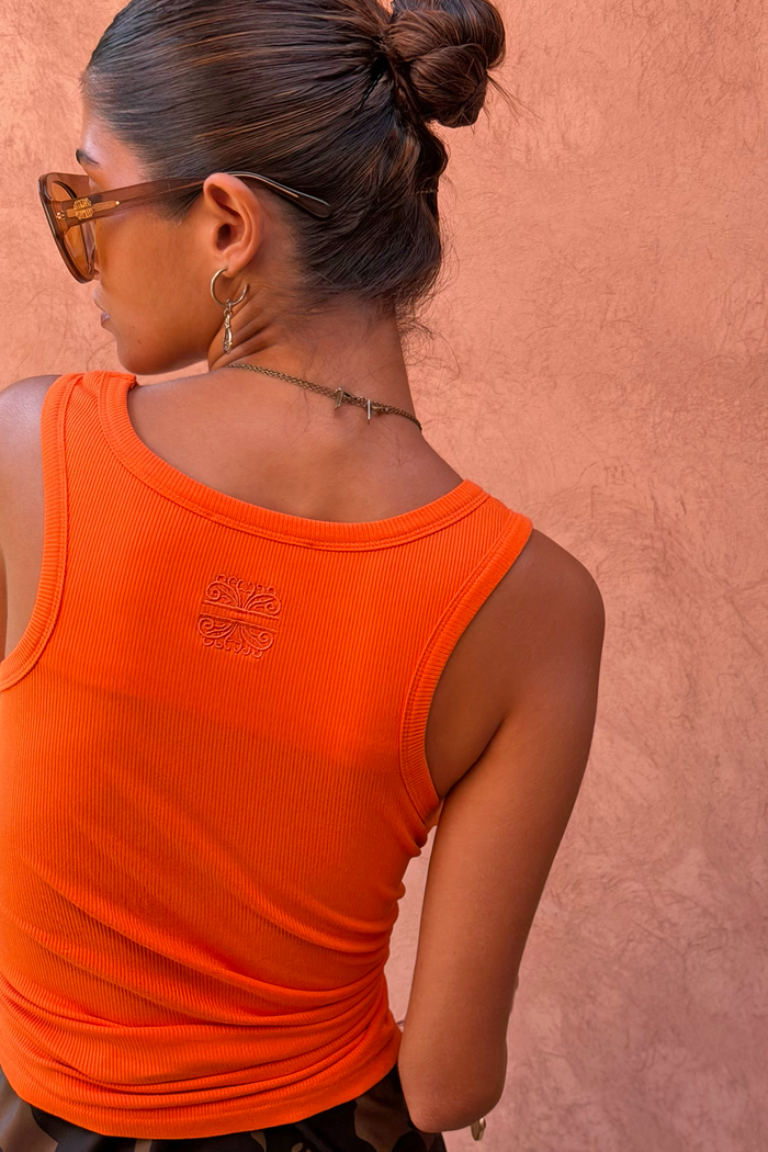 Coral Scoop Neck Rib Tank in a soft ribbed fabric, featuring a tonal embroidered NFD logo on the upper back.
