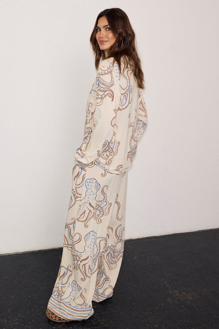 Cream Octopus Button Through Pyjamas featuring a blue and brown octopus print, styled in a relaxed fit on a model.