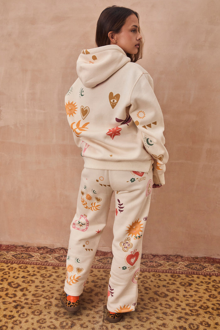 NFD Cream Sundazed Accessible Hoodie with colourful sun and heart prints, styled with matching joggers.