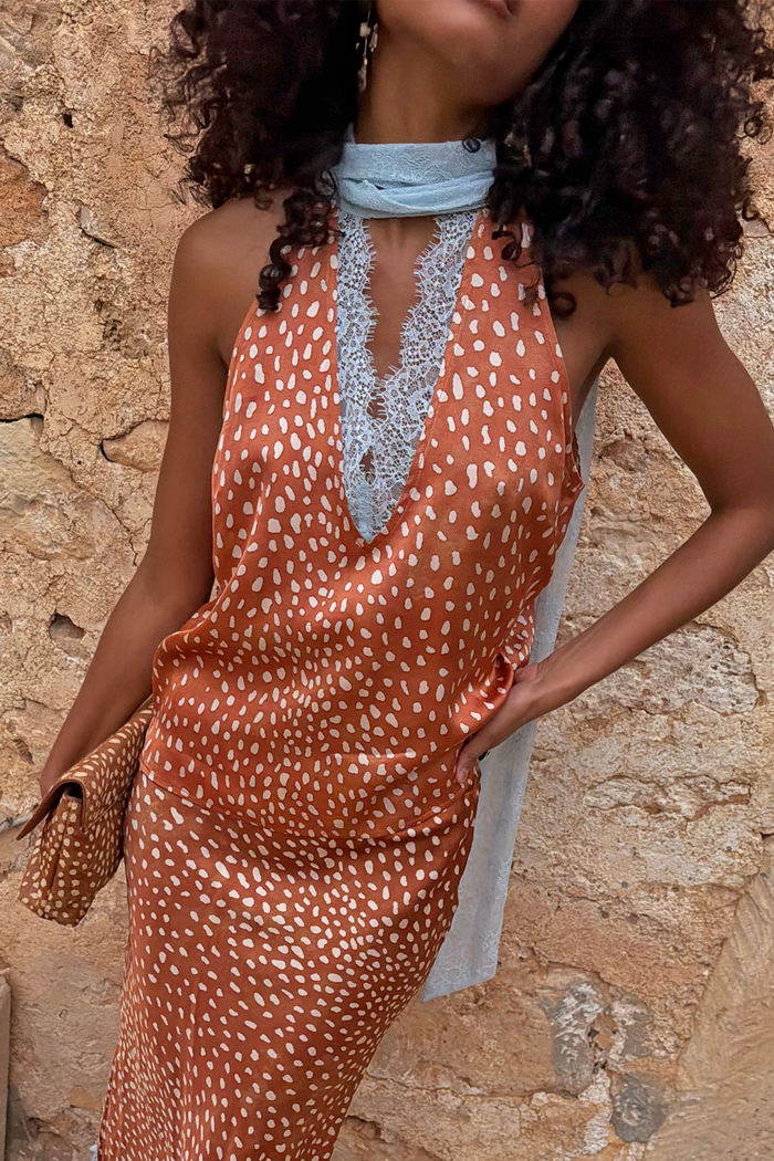 Multi-wear Fawn Lily Top in brown fawn print featuring light blue lace neck ties and a deep V-neckline.