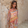 Dolce Vita Cape Top in a pastel tile patchwork print with wide sleeves, matching scarf and trousers for a vacation co-ord.