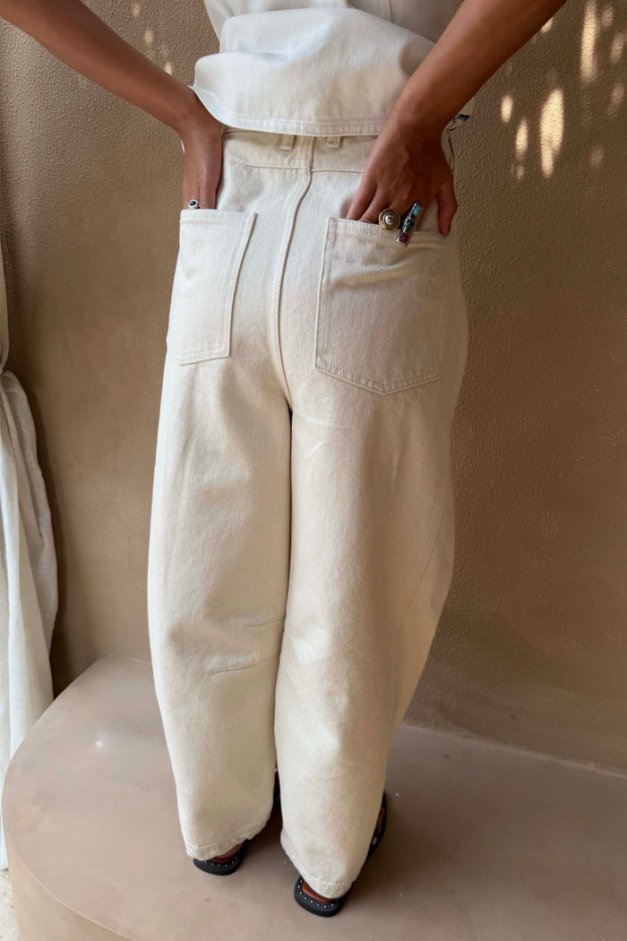 Cream Dolce Vita Denim Barrel Leg Jeans featuring an embroidered NFD logo on the back pocket.