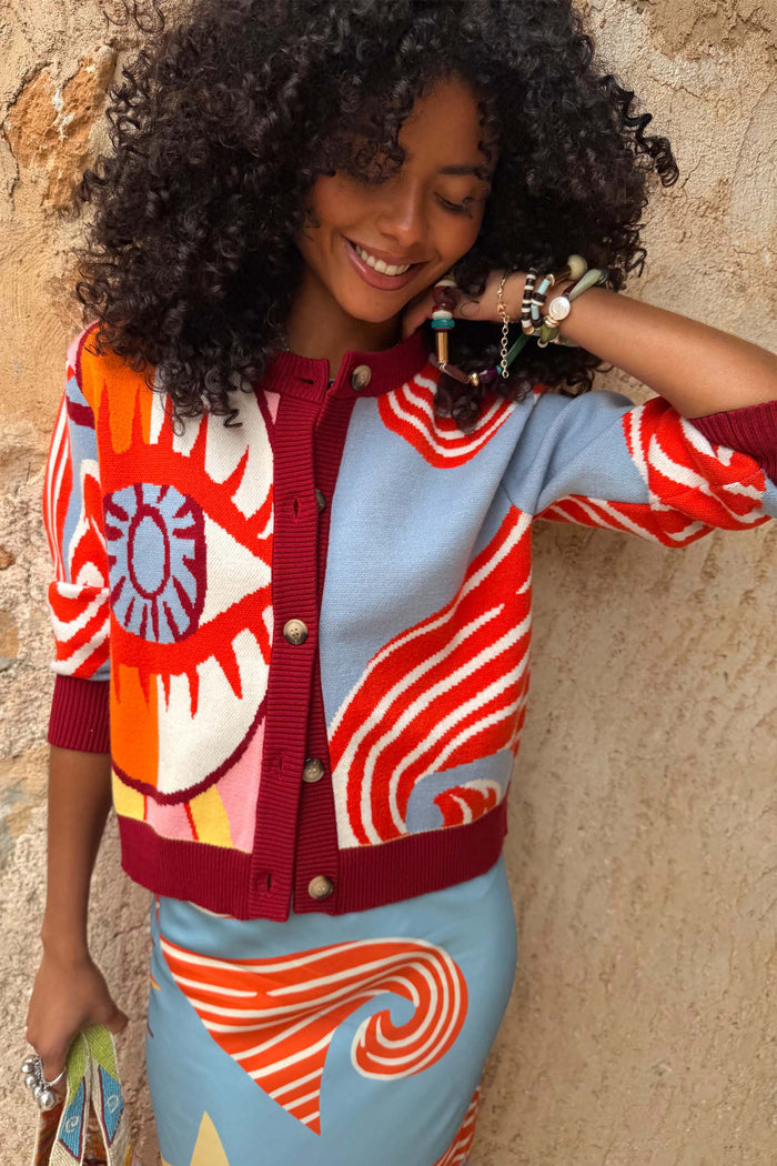 Dolce Vita Hollie Cardigan featuring an eye graphic, colour-block knit and burgundy ribbed trims.