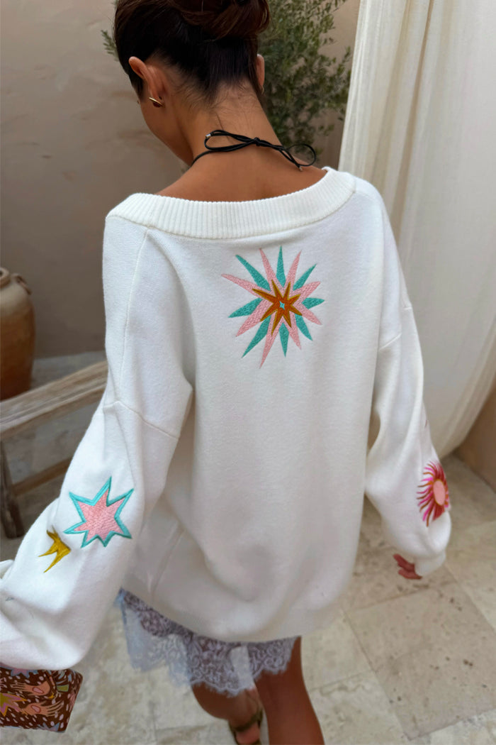 Cream Dreamer Martha Cardigan in a soft-touch knit with colourful sun and star motifs on the back and sleeves.