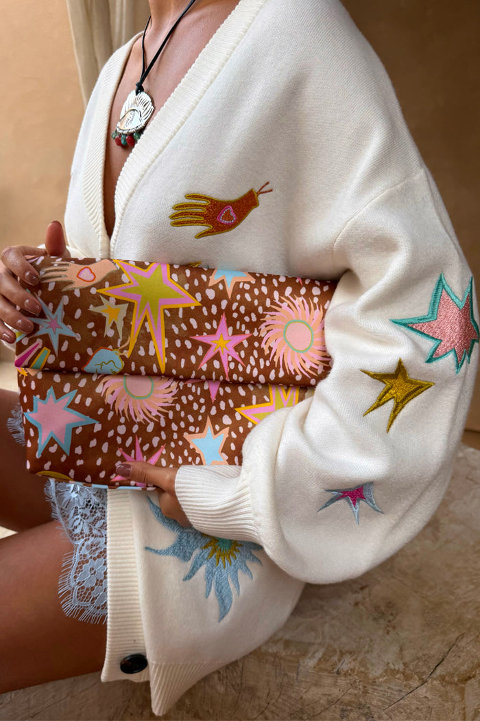 Cream Dreamer Martha Cardigan with colourful embroidered motifs in a soft-touch knit, designed in London.