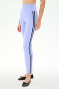 Model wears SPLITS59 Ella High Waist Airweight 7/8 leggings in Purple Haze/Black, featuring two black side stripes, paired with black ballet flats against a plain white background.