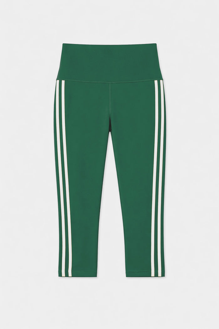 The SPLITS59 Ella High Waist Airweight Capri in Arugula/White features a cropped silhouette, high waistband, and two vertical white side stripes, shown against a plain white background.