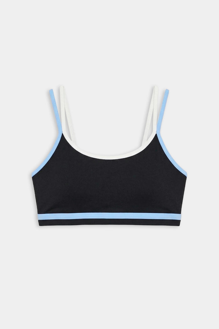 The SPLITS59 Eva Rigor Double Strap Bra in Black/Skylight features blue trim, white shoulder straps, and is shown on a plain white background.