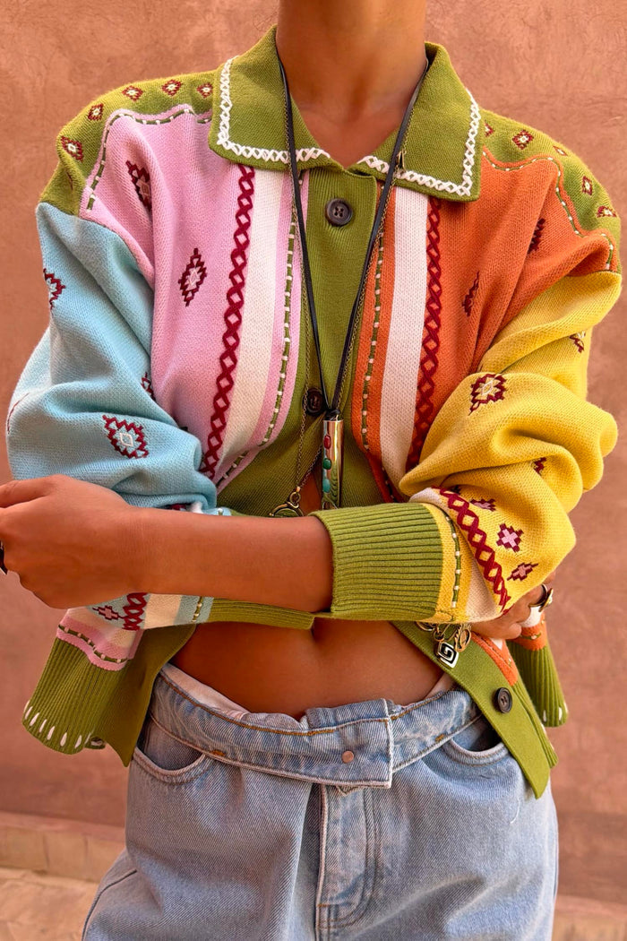 Geometric Palm Cardigan in green with colourful jacquard motifs and blanket stitch detailing.