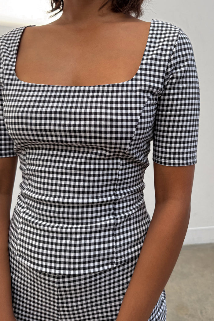 Gingham Top in a black and white check with a deep square neckline and corset-style dart detailing.