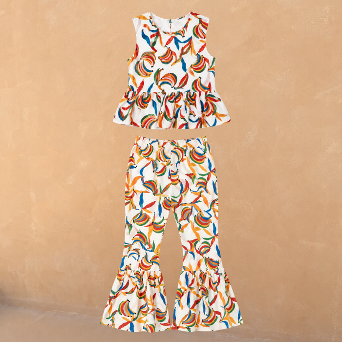 Multicoloured banana print cotton co-ord with a sleeveless peplum top and matching flared trousers.