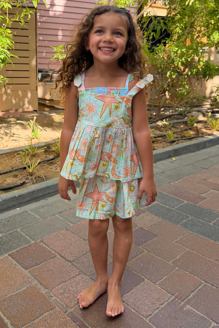 Blue Starburst Skirt Co-ord Set with sun and star prints, featuring a cotton peplum top and tiered skirt designed in London.