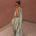 Green Diamond Print Halter Top in olive satin with a draped scarf detail, worn as a co-ord with matching trousers.