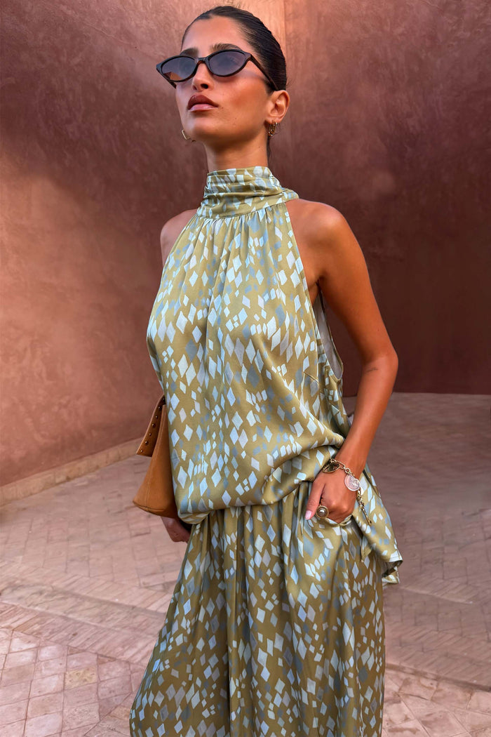 Green Diamond Print Halter Top in olive satin with a high neck, styled as a co-ord with matching trousers.