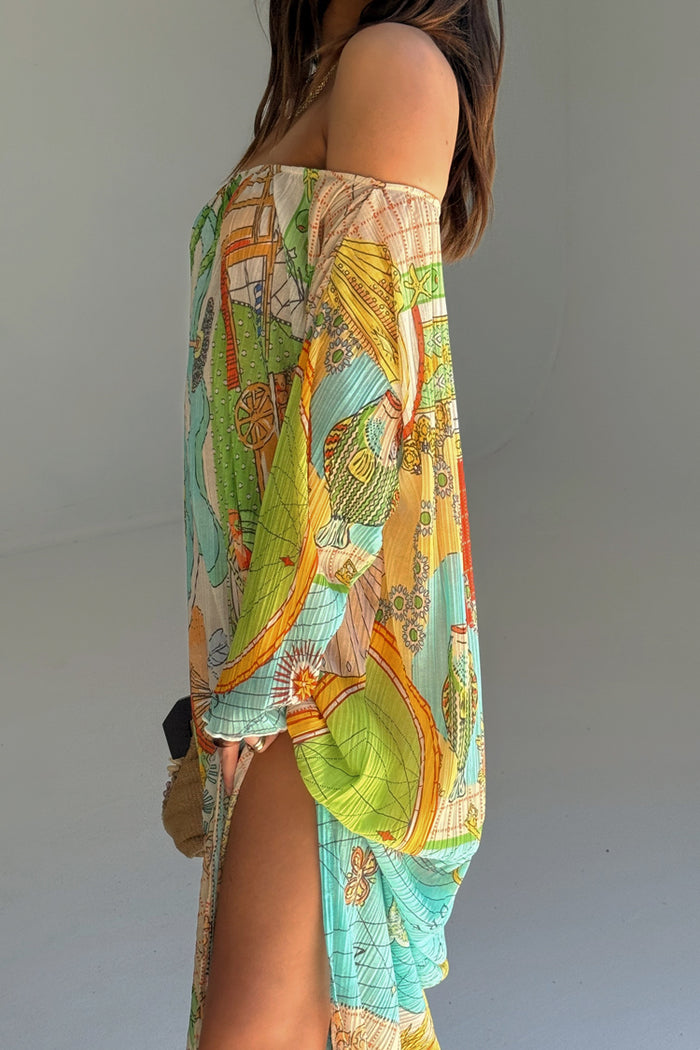 Isla Jem Dress in a multi-coloured hand-painted island print, featuring stretch plisse fabric and a side slit.