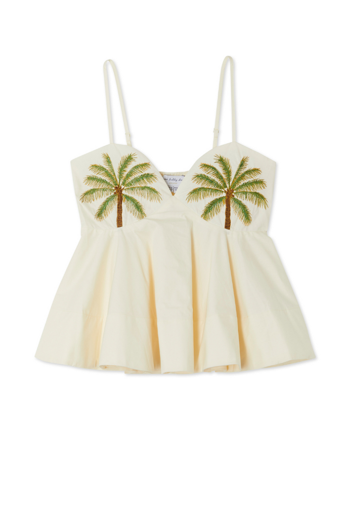 Ivory Palm Nara Top in cream cotton with green palm tree motifs, thin adjustable straps and a floaty silhouette.