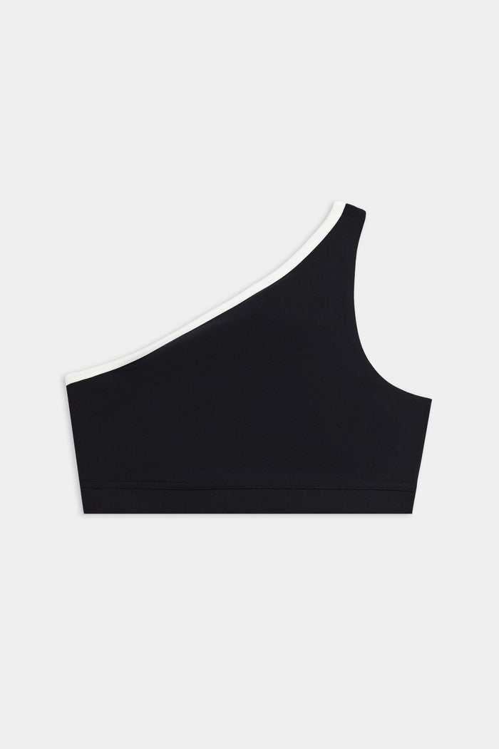 The SPLITS59 Josie Airweight One Shoulder Bra in Black/White features a white-trimmed neckline and is shown against a plain white background.