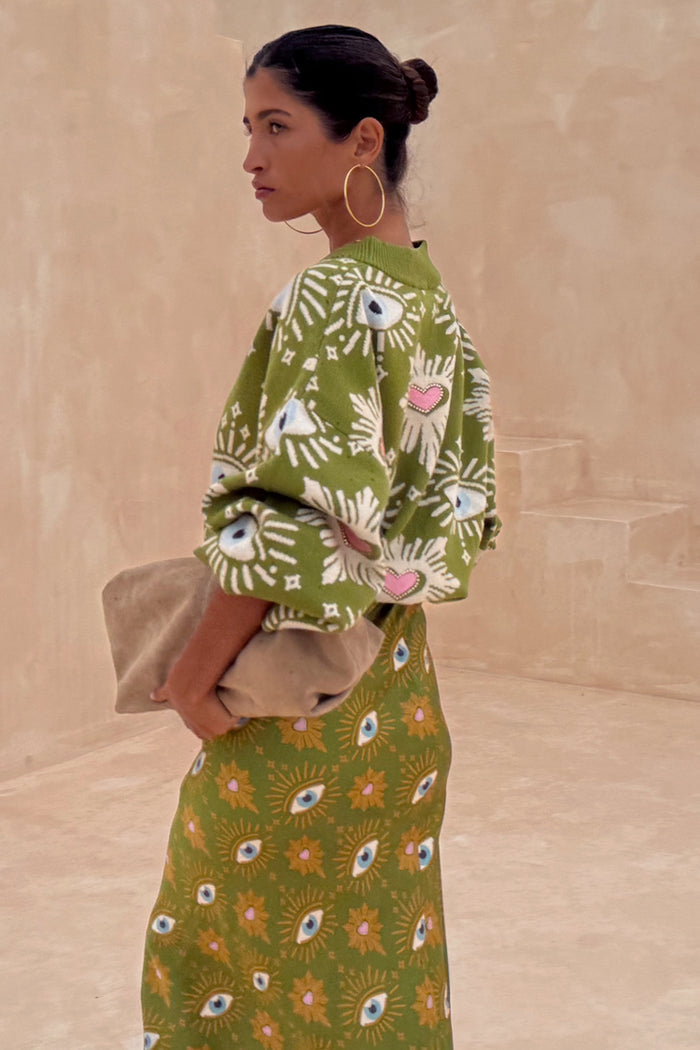 Khaki Eye Dorris Skirt and matching cardigan featuring green and pink heart and eye motifs, designed in-house in London.