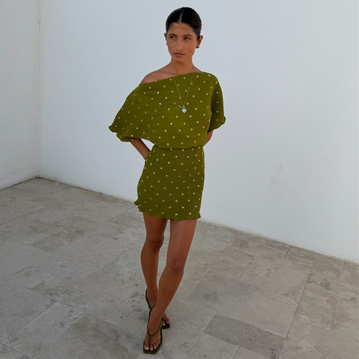 Iconic Khaki Mini Plisse Tilly Dress featuring a gold fleck shimmer and stretchy textured fabric.