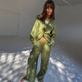 Khaki Shell Trousers featuring a gold shell print and wide-leg fit, styled as a co-ord with a matching shirt.