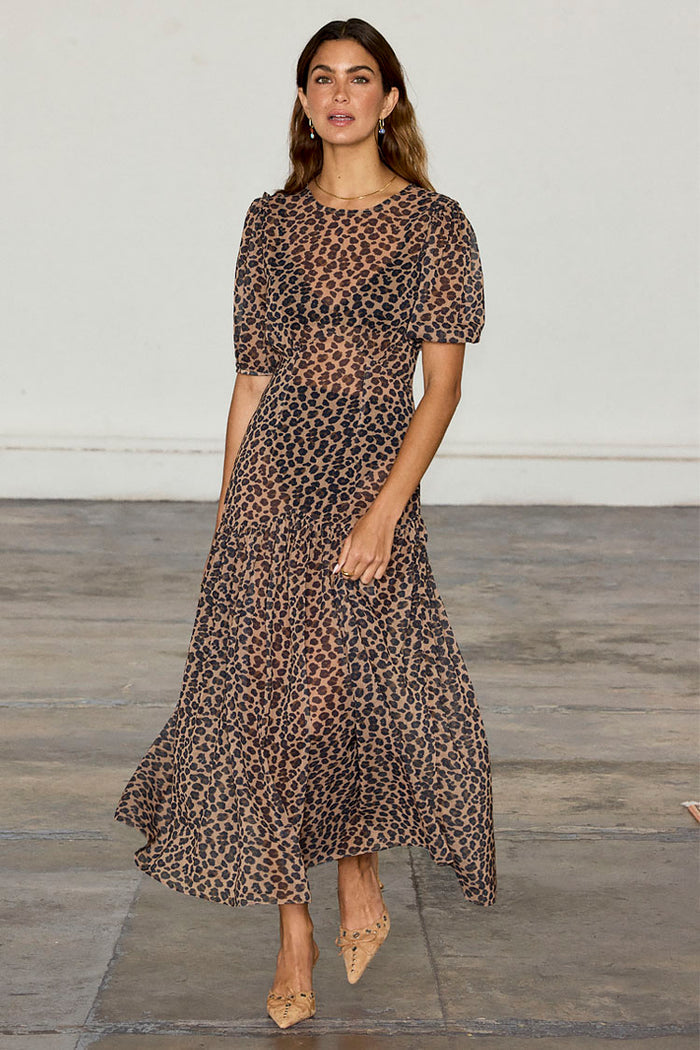 Leopard Lucia Dress featuring a sheer leopard print, voluminous puff sleeves and a tiered drop waist.