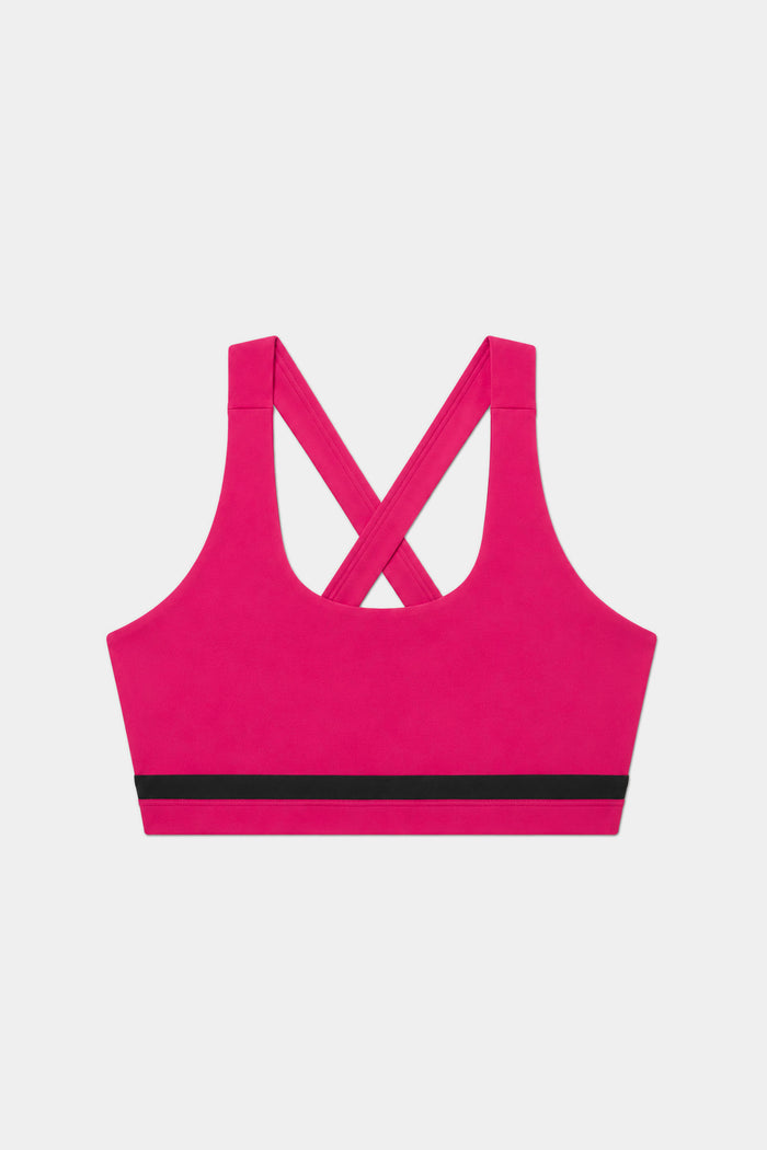 The SPLITS59 Miles Rigor Bra in Sangria/Black features smooth nylon-spandex fabric, a black bottom band, and crisscross back straps, shown on a plain white background.
