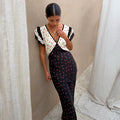 Mono Rose Betsy Midi Dress with red rose print, contrast panels, frill sleeves and a tie-detail V-neckline.