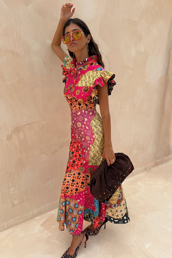Morocco Remi Dress featuring an abstract patchwork print, pleated frill neckline and ruffled sleeves.