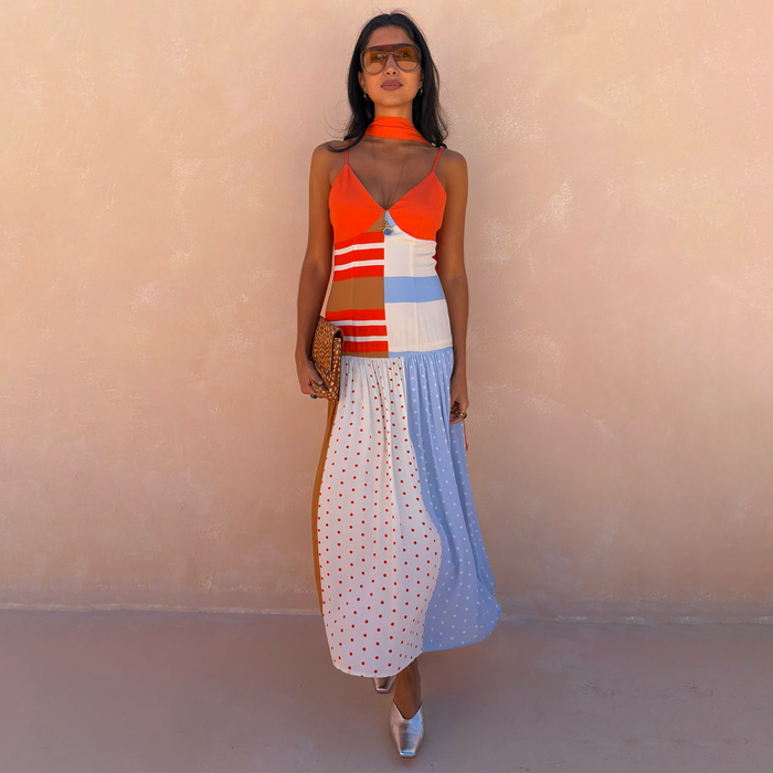 Multi Stripe Bea Dress in an orange and blue colourway with a pleated polka dot skirt and matching neck scarf.