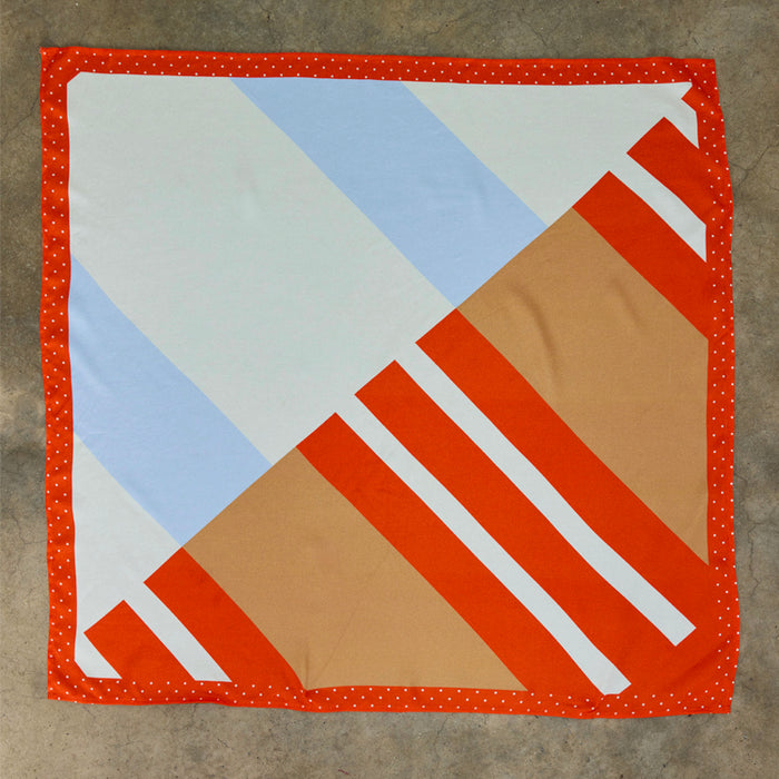 Multi Stripe Mix Bandana with orange and blue stripes and a red polka dot border, a multi-wear piece designed in London.