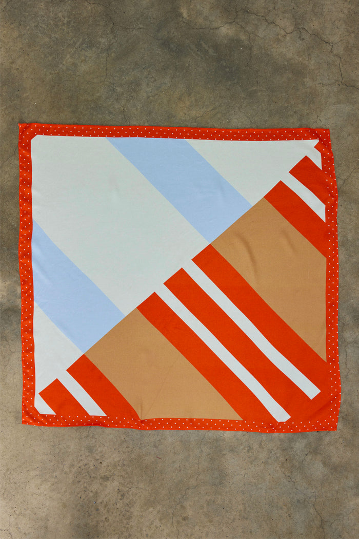Multi Stripe Mix Bandana in viscose with orange, blue and tan diagonal stripes and a polka dot border.