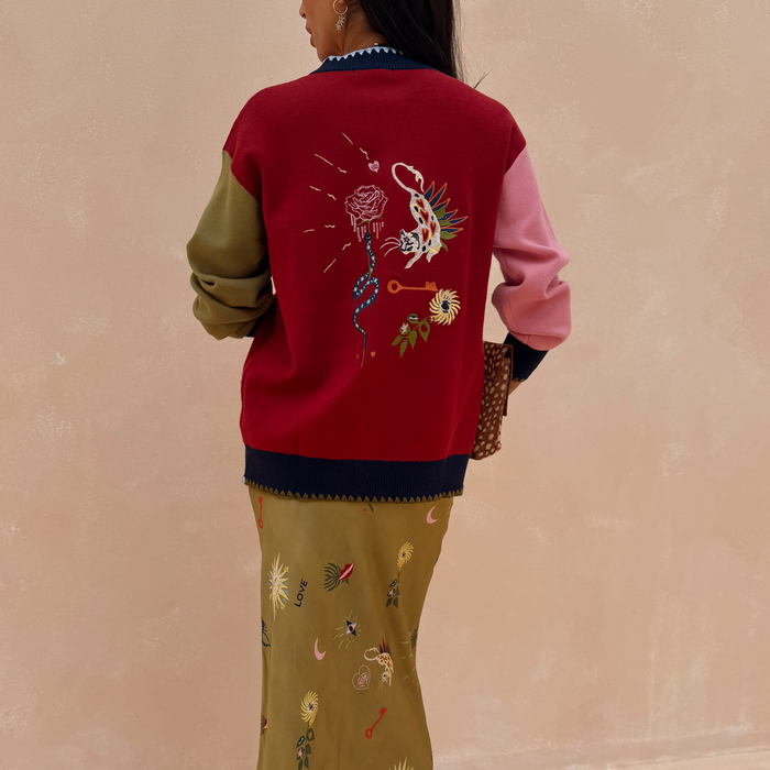Mystical Martha Cardigan with embroidered back motifs, multicoloured sleeves and contrast blanket stitching.