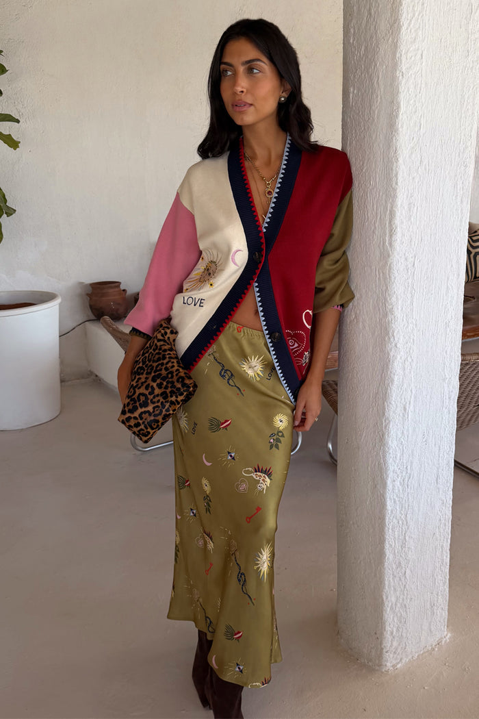 Mystical Martha Cardigan in a multicoloured soft-touch knit, styled with a matching olive skirt and leopard clutch.