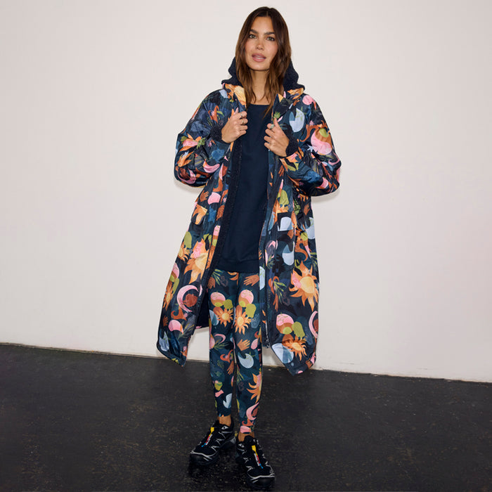 Navy Charm Coat with a colourful sun and moon print, waterproof fabric and borg lining.