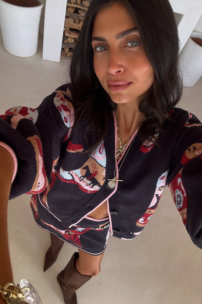 Navy Cowboy Boots Cardigan featuring pink trims and western motifs, styled as a co-ord with a matching skirt.