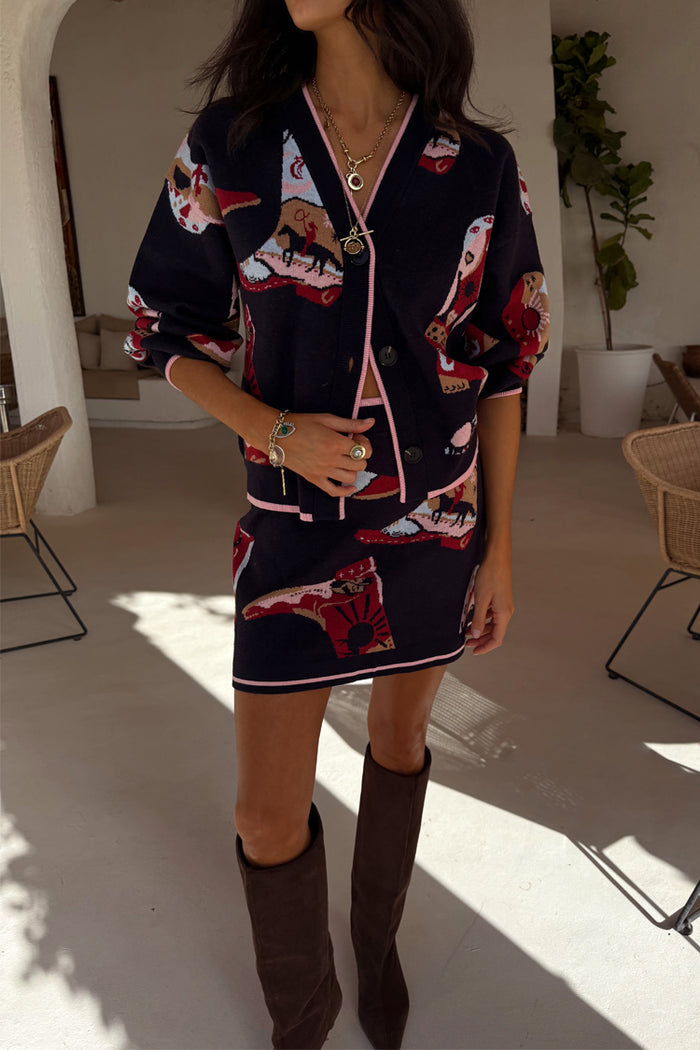 Navy Cowboy Boots Jake knit mini skirt with cowboy motifs and pink trim, styled as a matching co-ord.