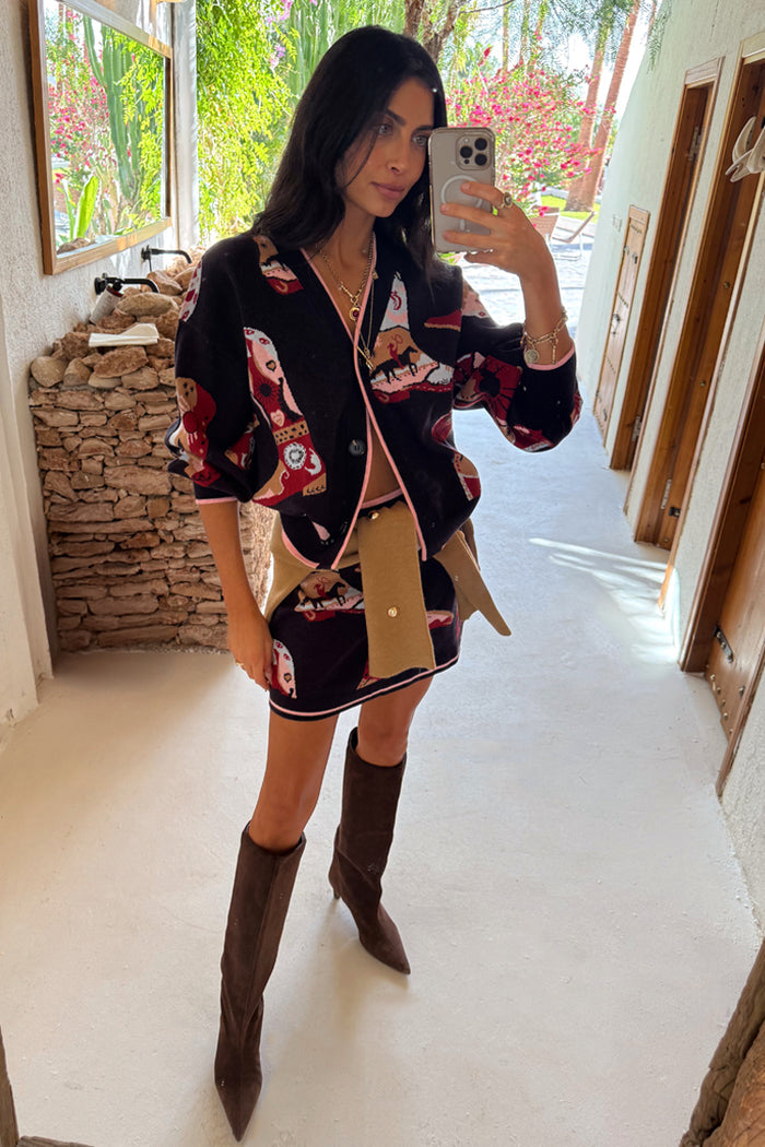 Navy Cowboy Boots Jake Skirt and matching cardigan with western motifs and pink trim on a model.