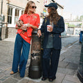 Navy Pinstripe Arden Trousers and matching blazer styled on a London street for an iconic smart casual look.