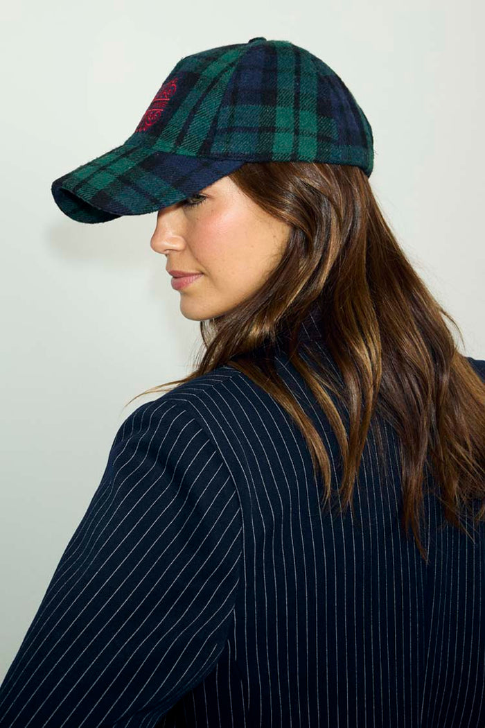 Navy Tartan NFD Cap in blue and green with a red embroidered logo, styled with a pinstripe blazer.
