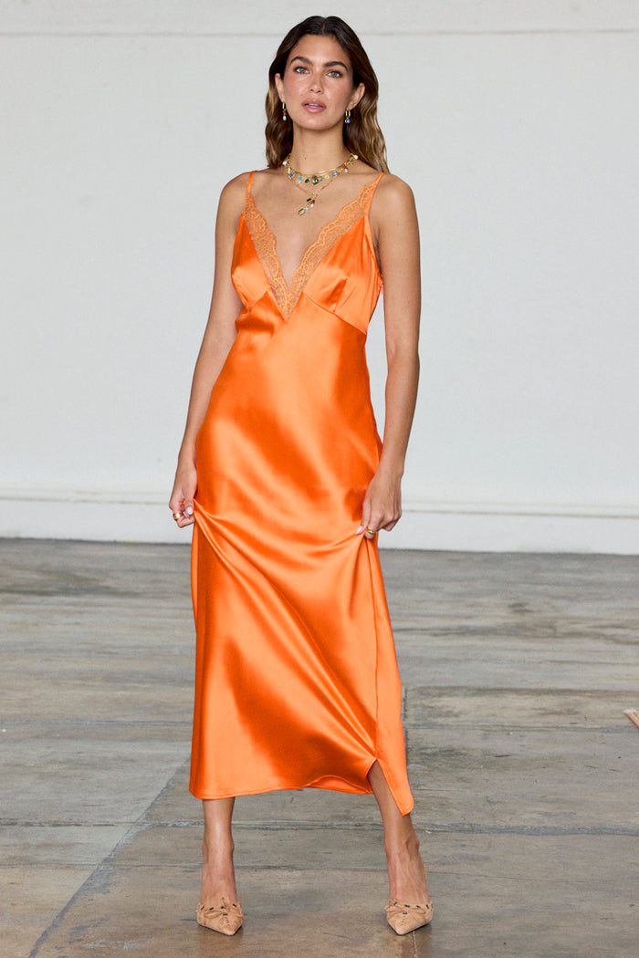 Orange Lily Dress in silky satin with a lace V-neckline; model wears UK 10 / US 6.