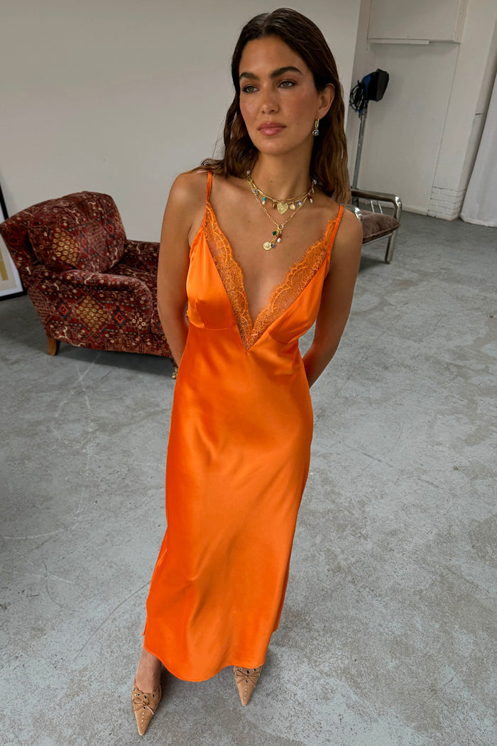 Orange Lily Dress in silky satin with a lace-trimmed V-neckline, perfect for feel good dressing.