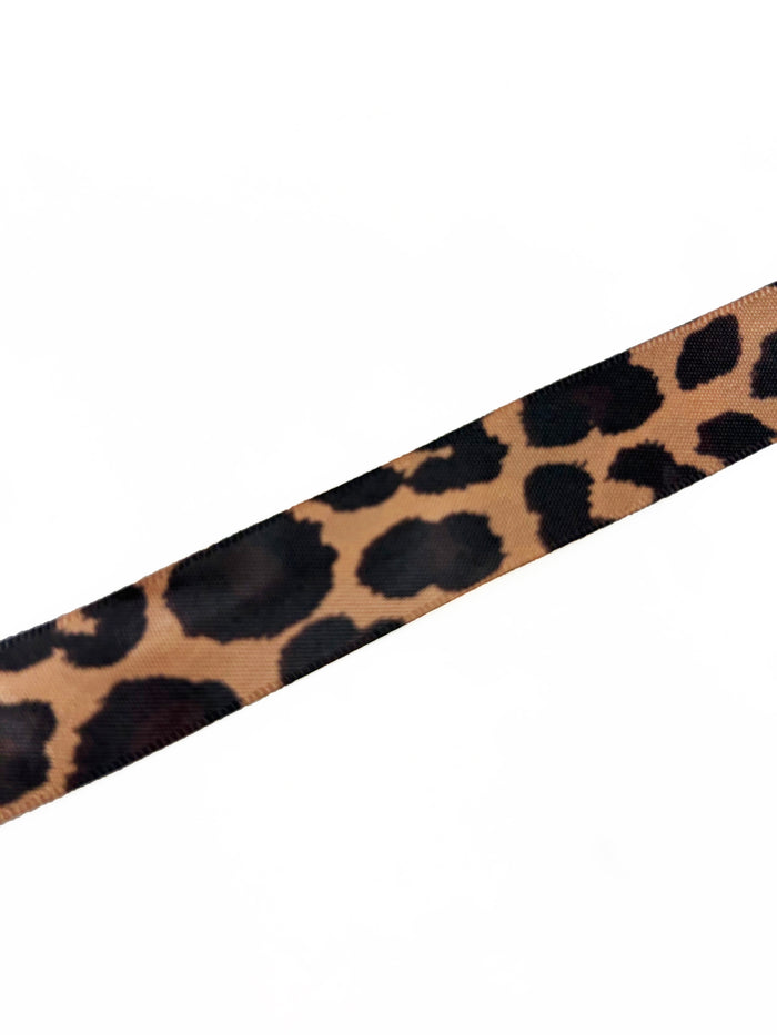 Signature leopard print ribbon tie for the Orange NFD Gift Bag, showcasing a classic black and tan animal pattern.